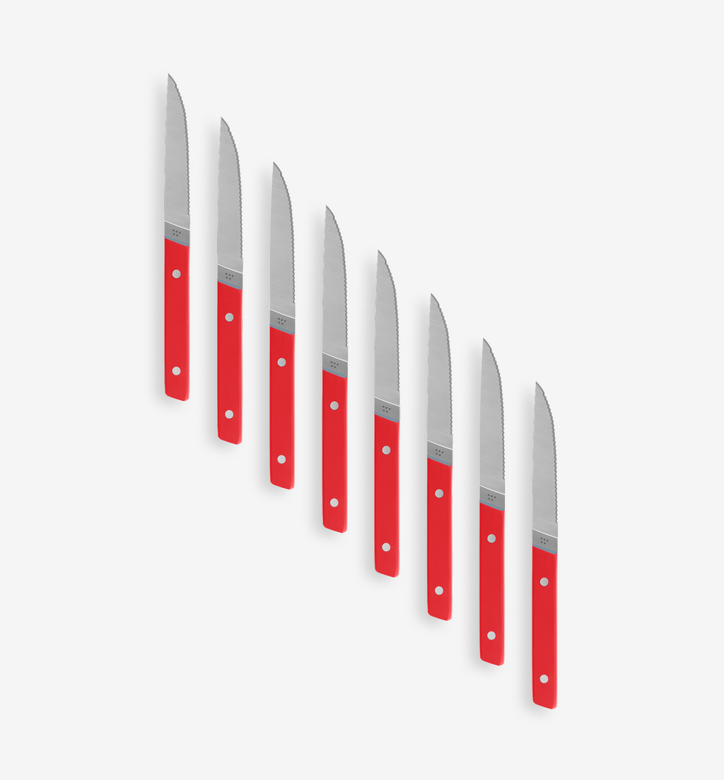 Set of 8 red-handled serrated steak knives with stainless steel blades